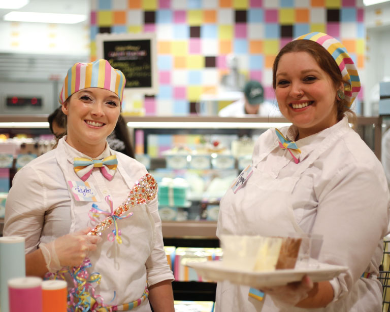 CakeryHostShowsOffFrosting